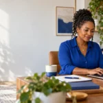 Calm business owner typing a reply on her laptop in a quiet back office